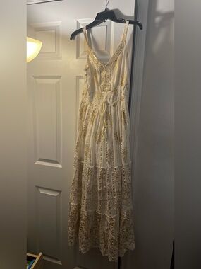 White and gold maxi dress with sequins and embroidery.